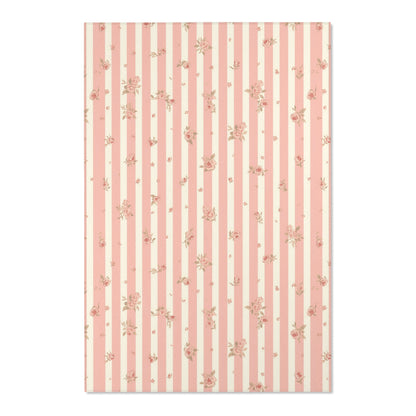 Close detail of the stripes and roses on the nursery area rug