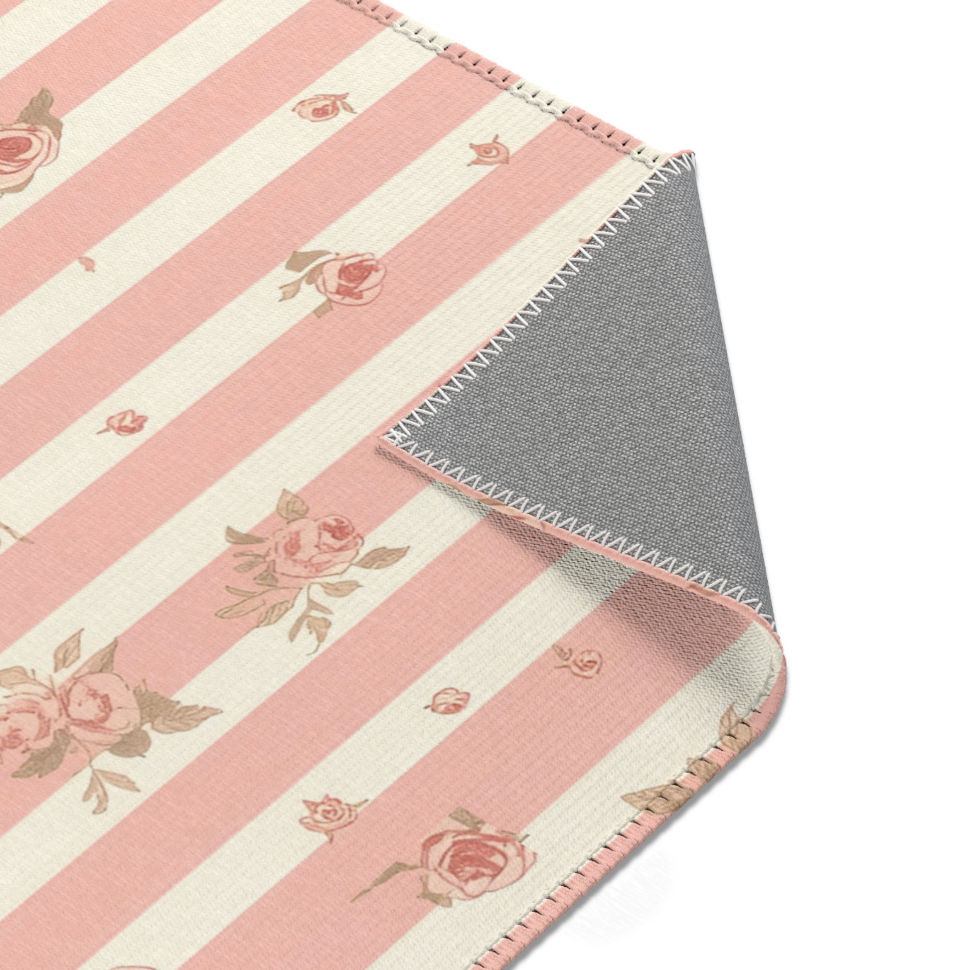 Striped rose rug in pink and cream for a nursery floor