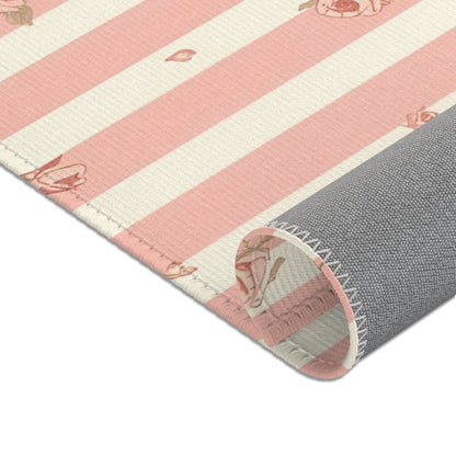 Nursery area rug in a pink, rose and cream palette