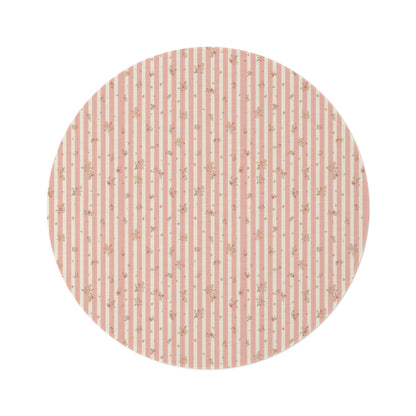 Rose Stripe round nursery rug on a baby room floor