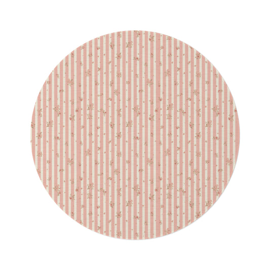Rose Stripe round nursery rug on a baby room floor