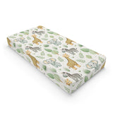 Safari animal changing pad cover on a nursery changing table