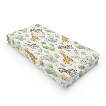 Safari animal changing pad cover on a nursery changing table