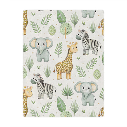 Safari animal minky baby blanket draped over a crib