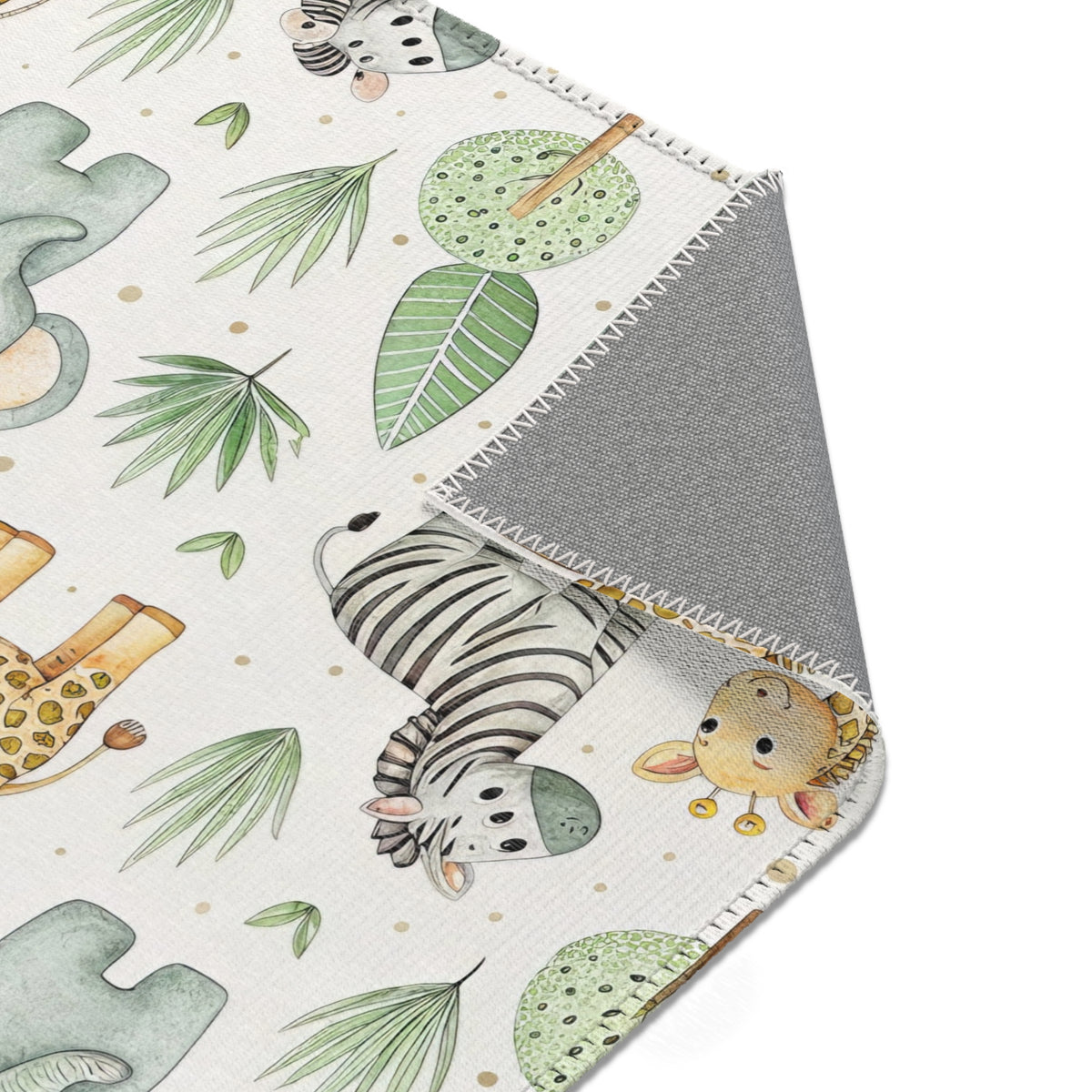 Safari animal area rug styled with nursery furniture