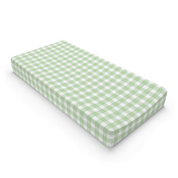 Sage Gingham changing pad cover on a nursery changing table