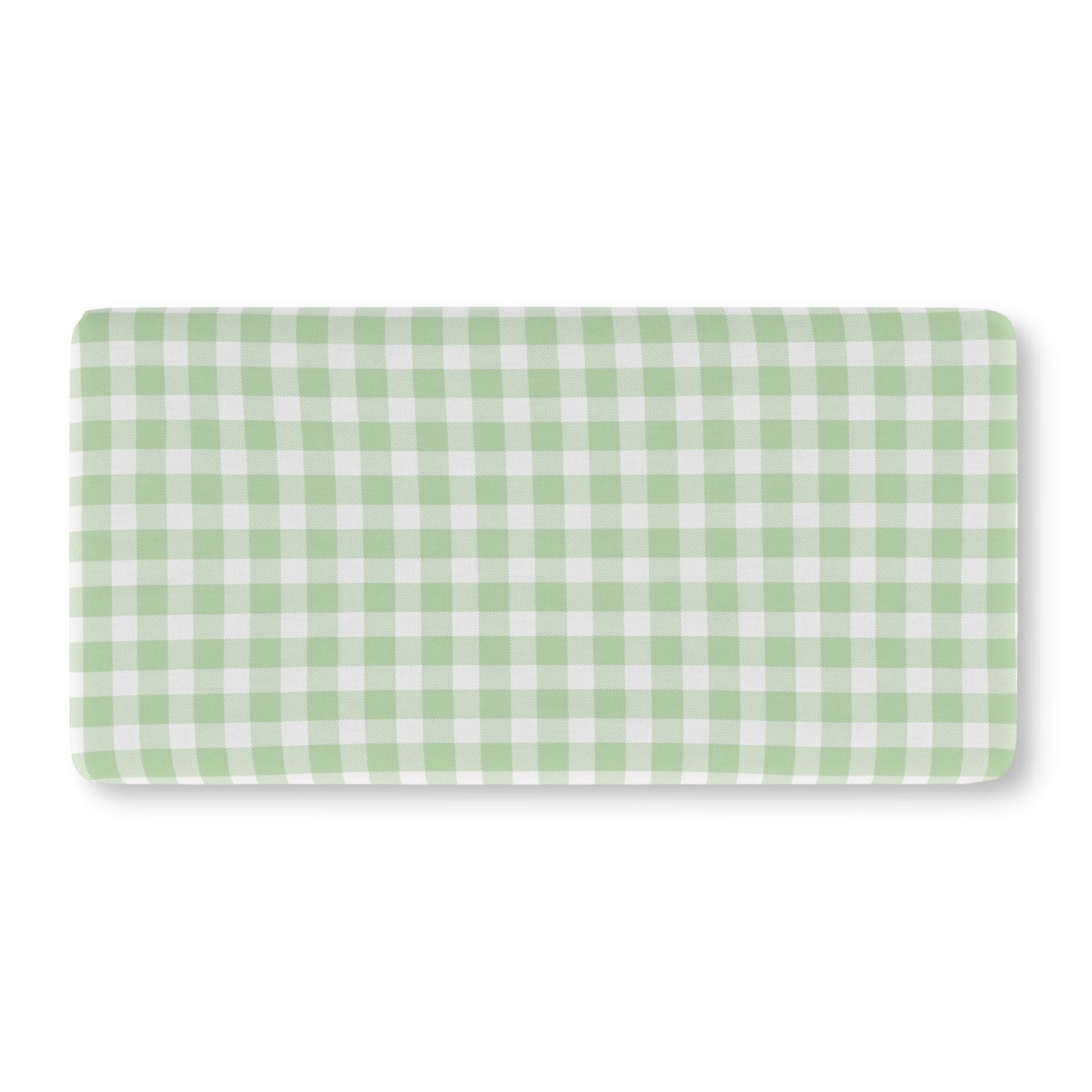 Green gingham crib sheet on a standard crib mattress