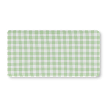 Green gingham crib sheet on a standard crib mattress