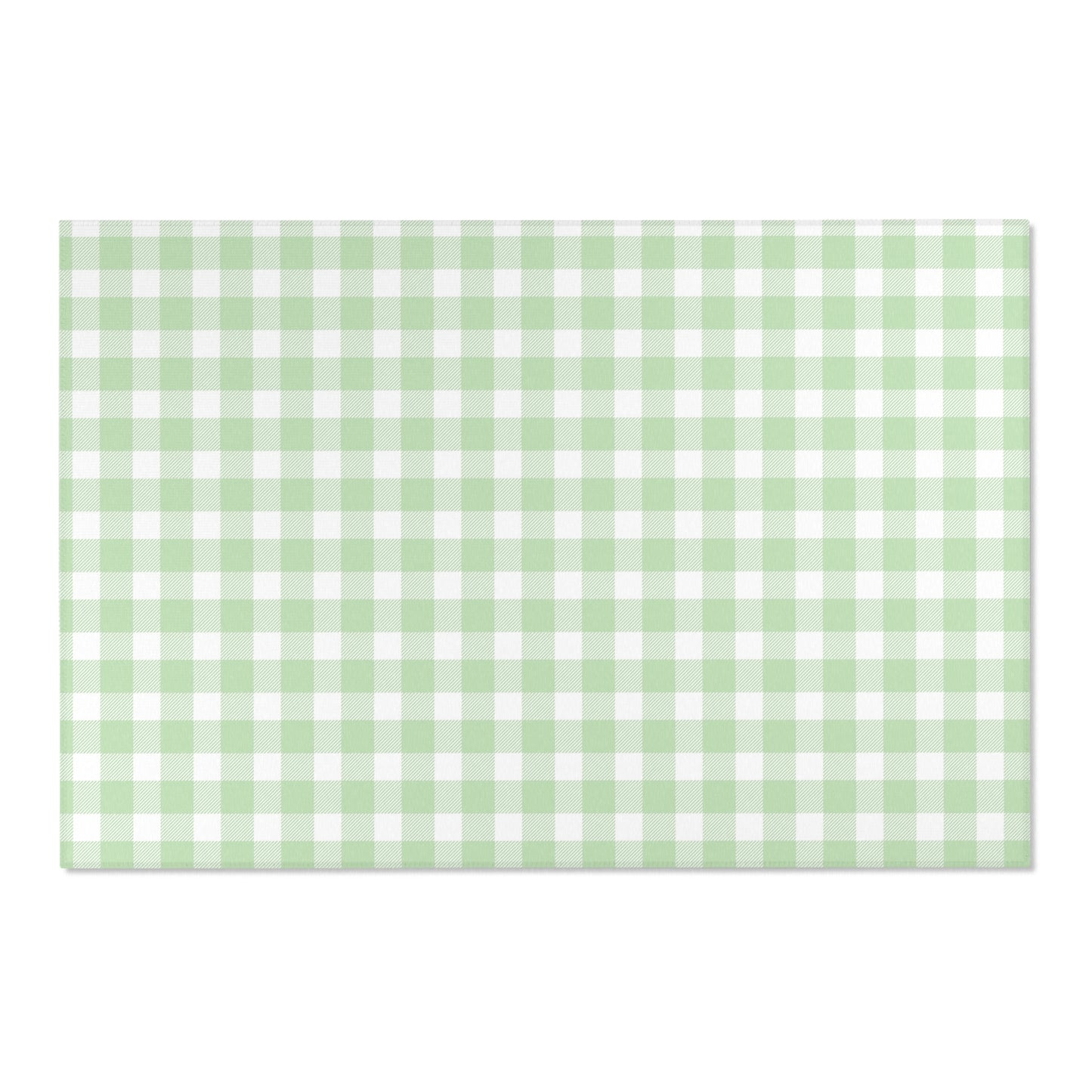 Soft green check rug defining a nursery play area