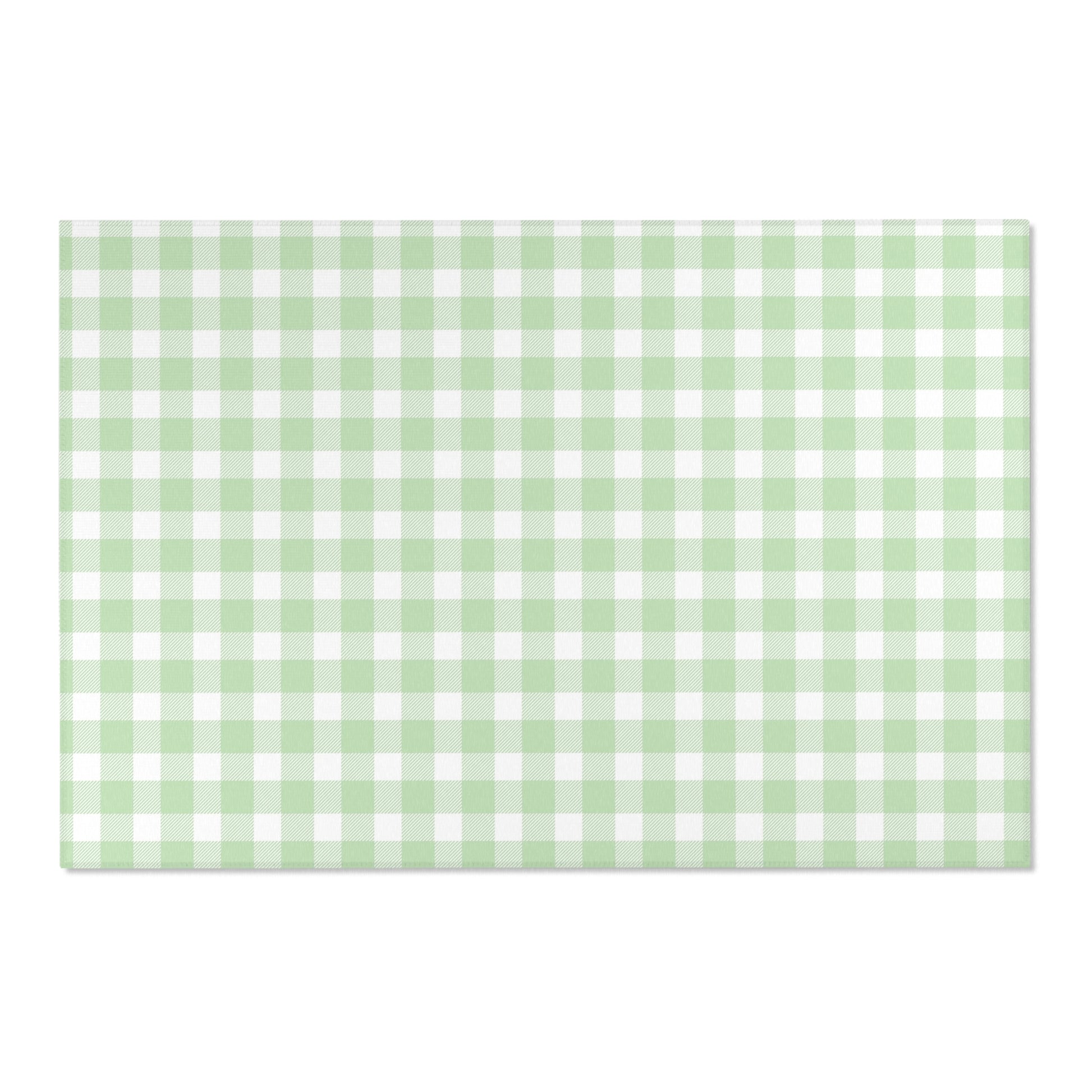 Soft green check rug defining a nursery play area