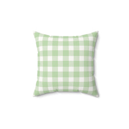 Sage Gingham decorative nursery pillow on a glider chair