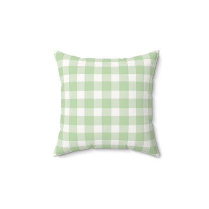 Sage Gingham decorative nursery pillow on a glider chair