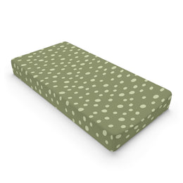 Sage Speckle changing pad cover on a nursery changing table