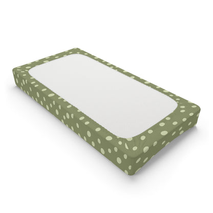 Changing pad cover in scattered cream dots on sage green