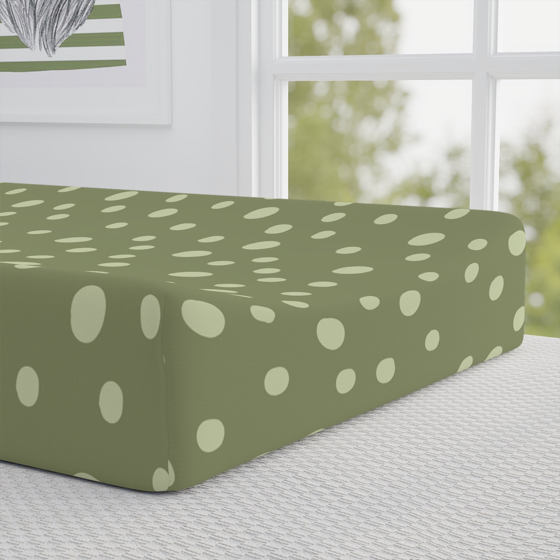 Close detail of the Sage Speckle dot print on the changing pad cover
