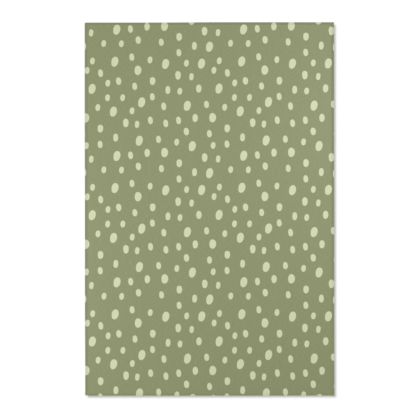 Close detail of the hand-painted dots on the nursery area rug