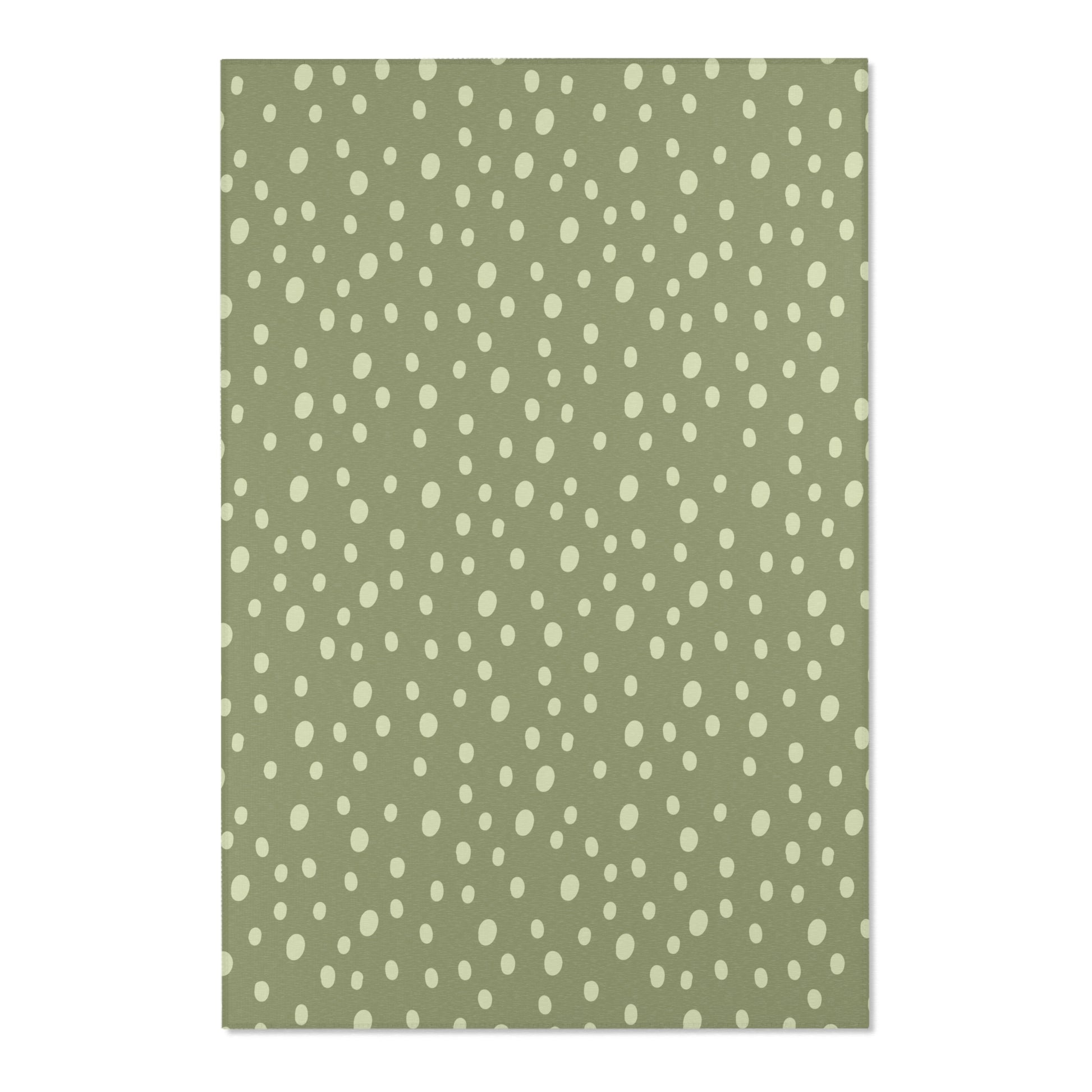 Close detail of the hand-painted dots on the nursery area rug