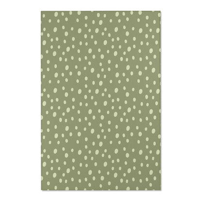 Close detail of the hand-painted dots on the nursery area rug