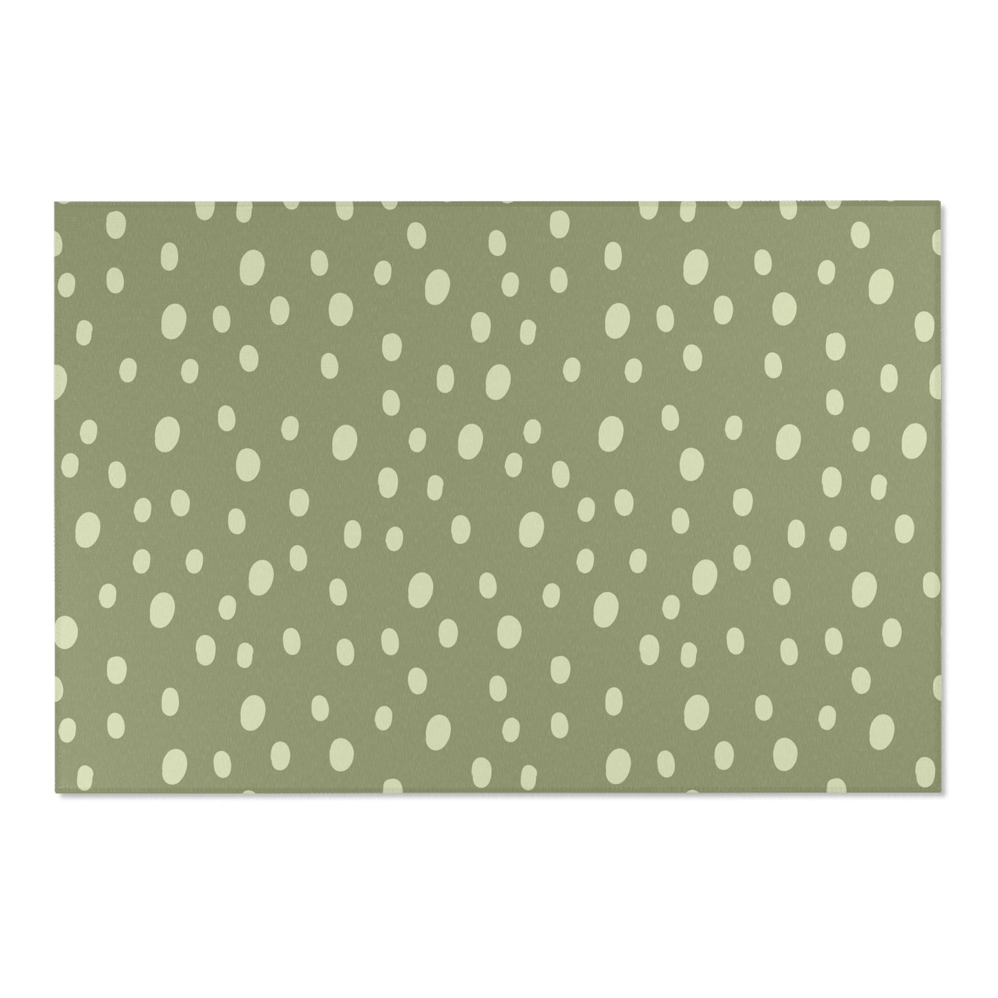 Low pile nursery rug with cream dots on a sage ground