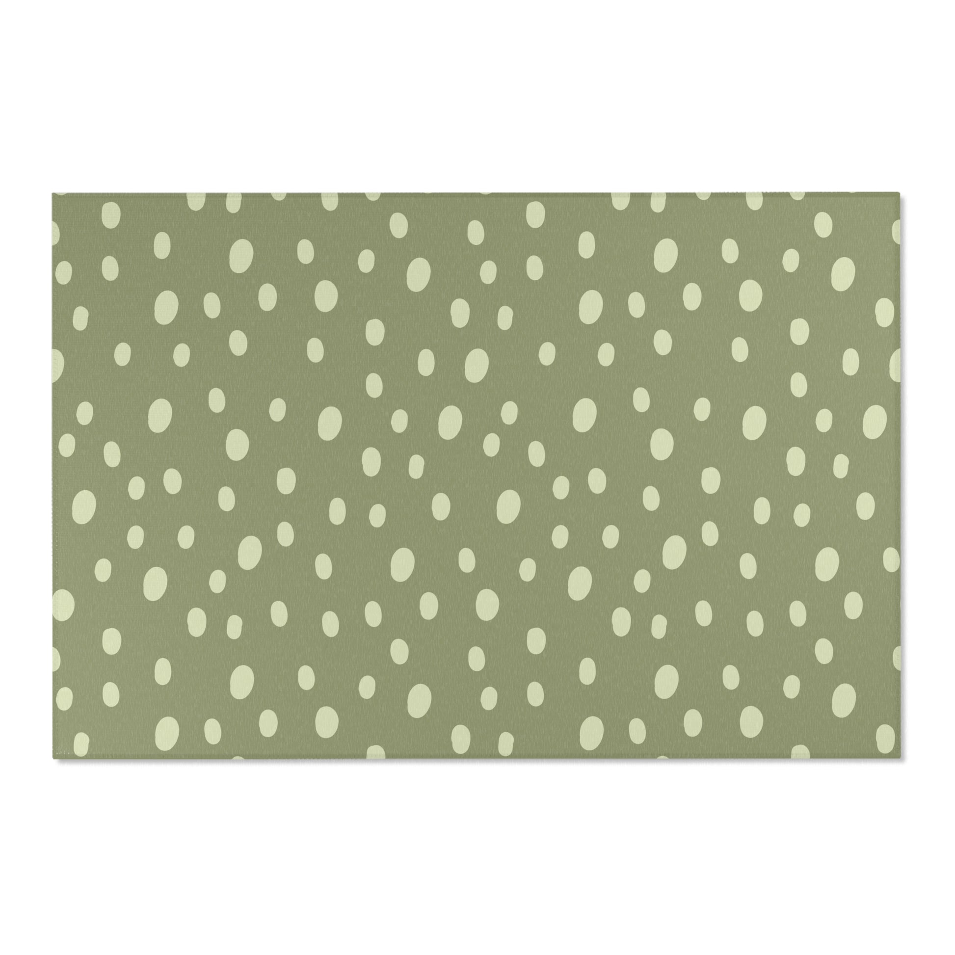 Low pile nursery rug with cream dots on a sage ground