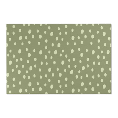 Low pile nursery rug with cream dots on a sage ground