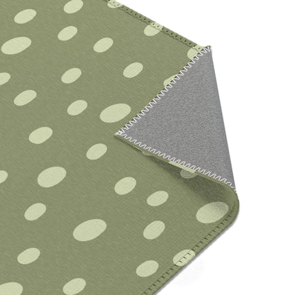 Dotted rug in cream and sage green for a nursery floor