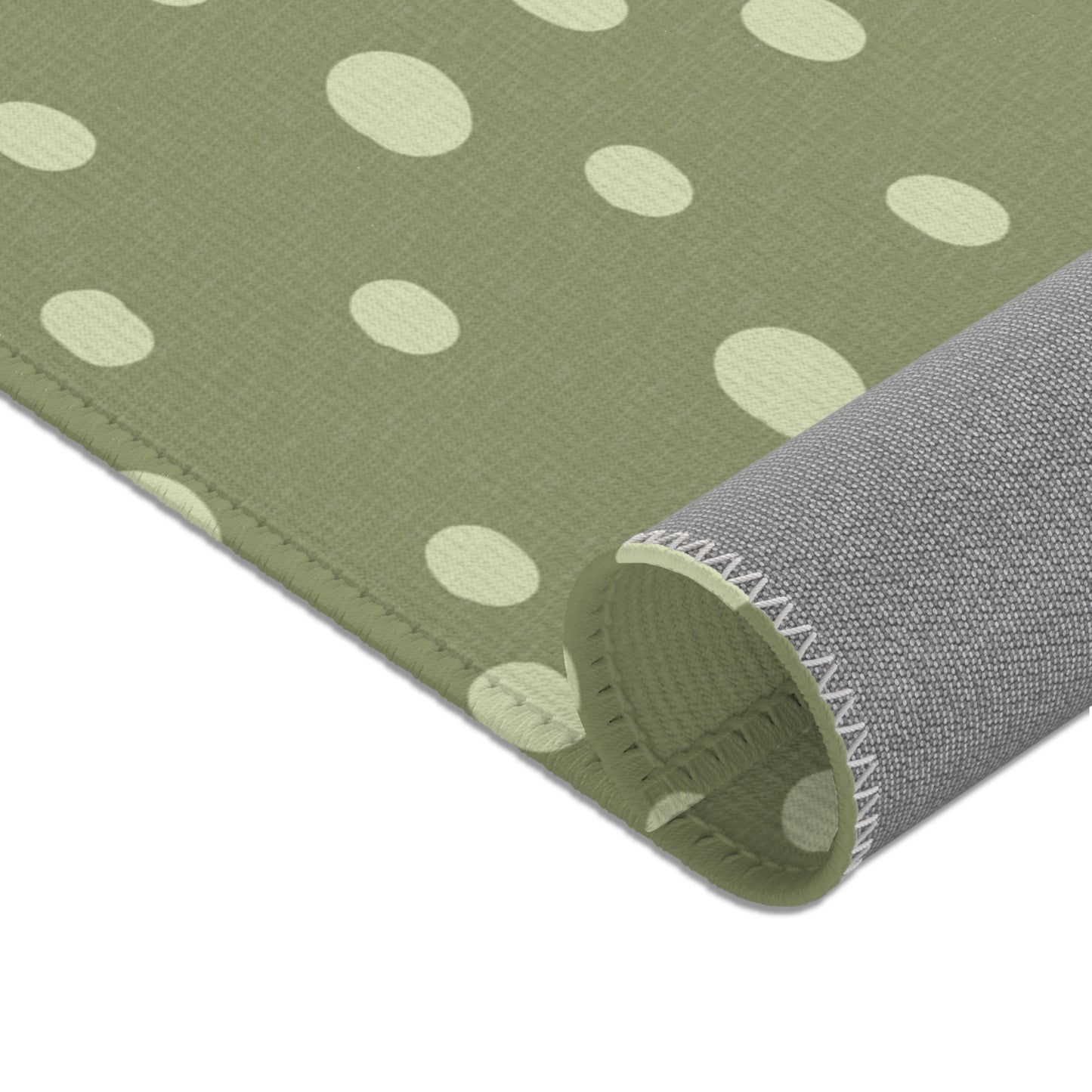 Corner detail of the Sage Speckle nursery area rug