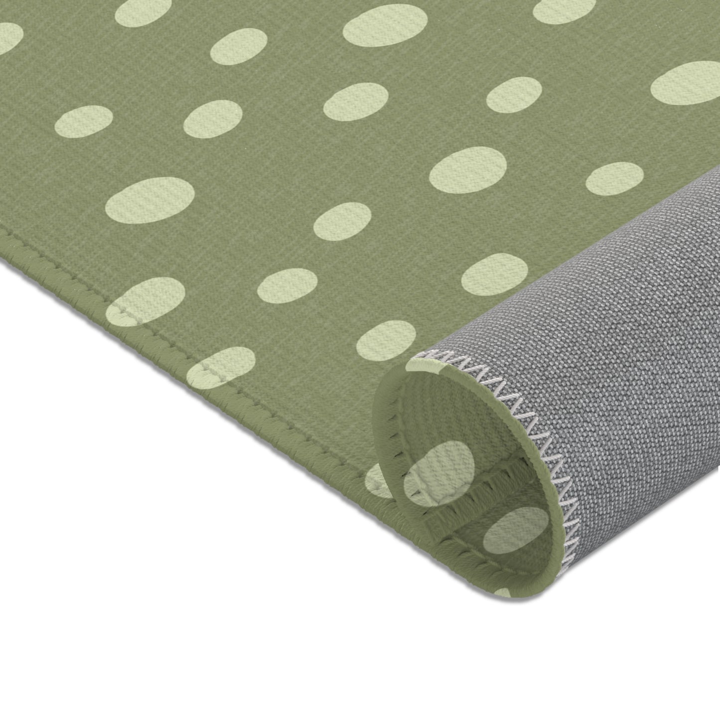 Uneven cream dots printed across the nursery area rug