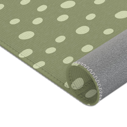 Uneven cream dots printed across the nursery area rug