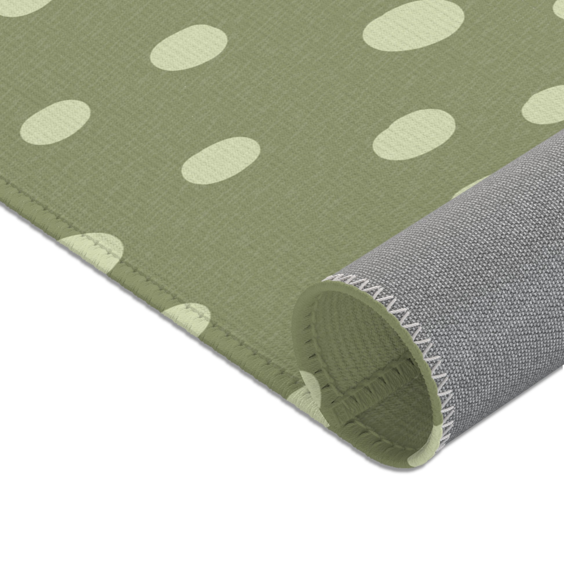 Nursery area rug in a neutral sage green and cream palette