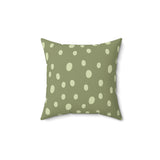 Sage Speckle decorative nursery pillow on a glider chair