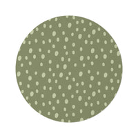 Sage Speckle round nursery rug on a baby room floor