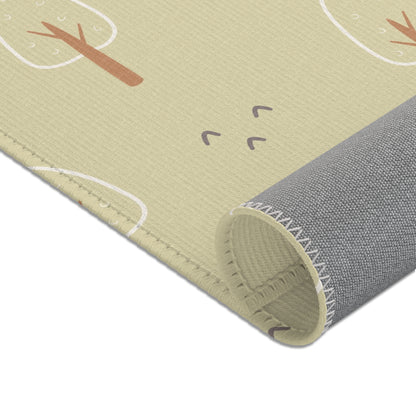 Nursery rug in green and cream in a styled baby room