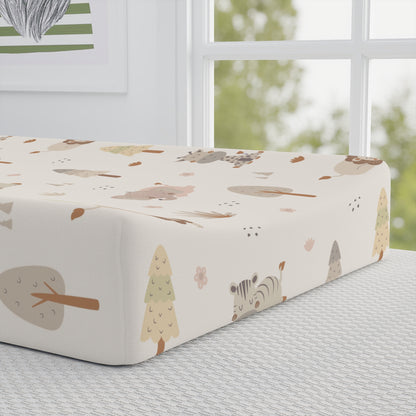 Close-up of the sleeping animal print on a changing pad cover
