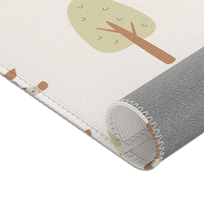 Cream safari print baby room rug in a styled nursery