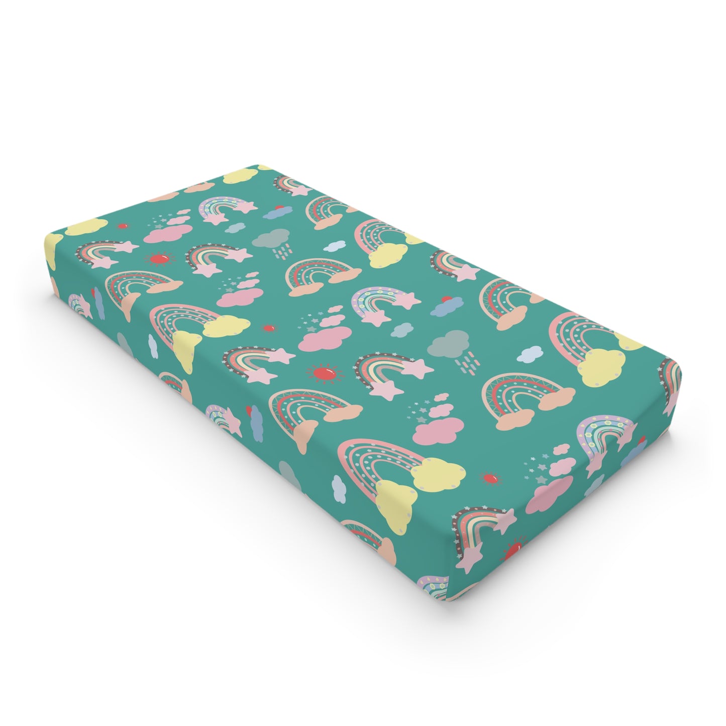Teal Sky Rainbows changing pad cover on a nursery changing table