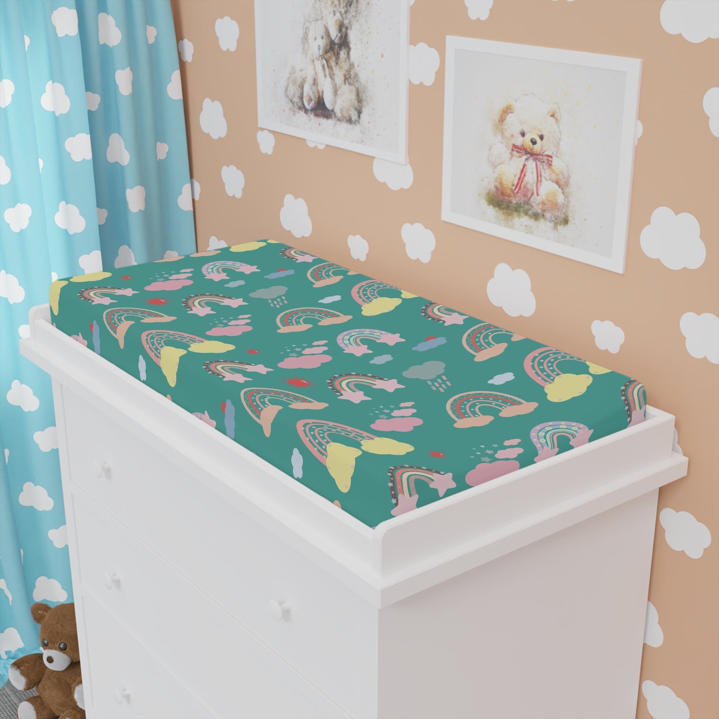 Teal Sky Rainbows changing pad cover fitted over a contoured pad