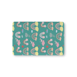 Teal Sky Rainbows fitted crib sheet on a nursery crib mattress