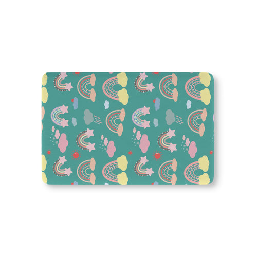 Teal Sky Rainbows fitted crib sheet on a nursery crib mattress