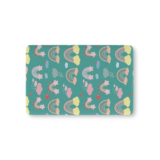 Teal Sky Rainbows fitted crib sheet on a nursery crib mattress