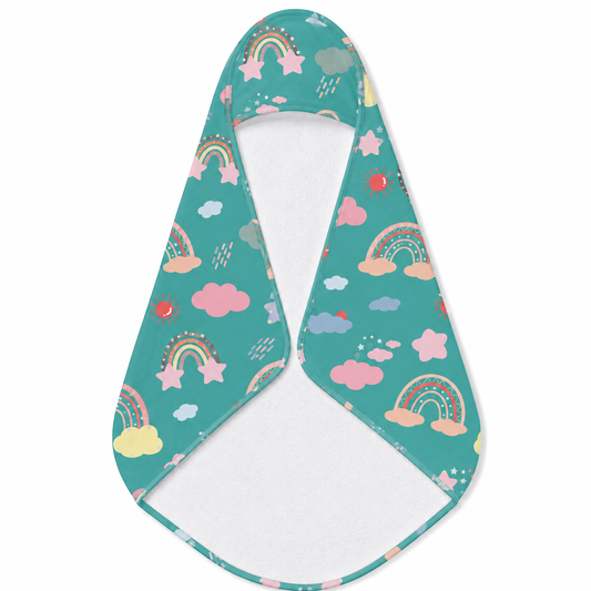 Teal Sky Rainbows hooded baby towel wrapped around a baby