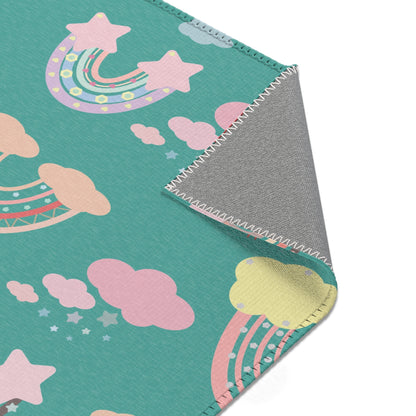Nursery area rug printed edge to edge with rainbows and clouds