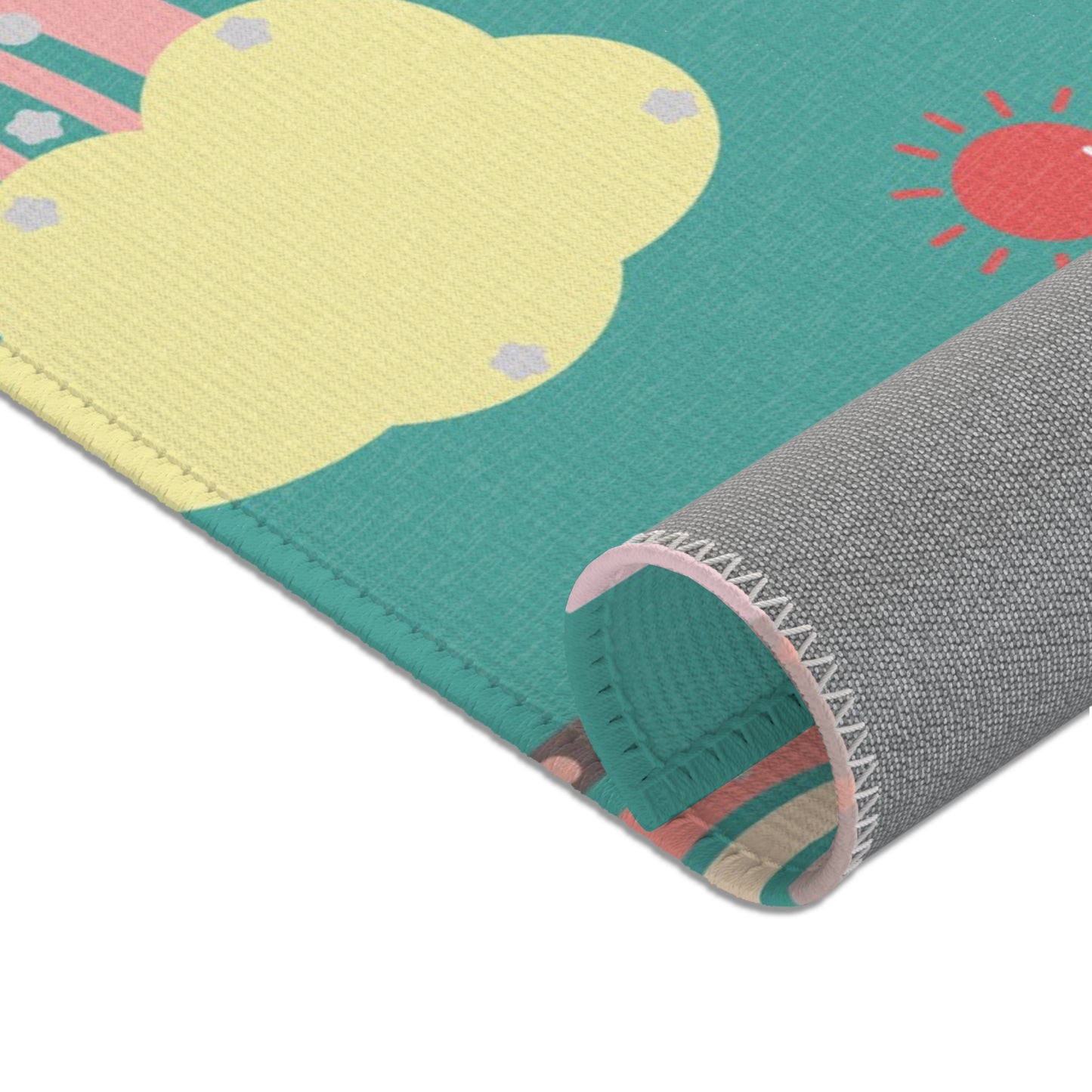 Corner detail of the Teal Sky Rainbows nursery area rug