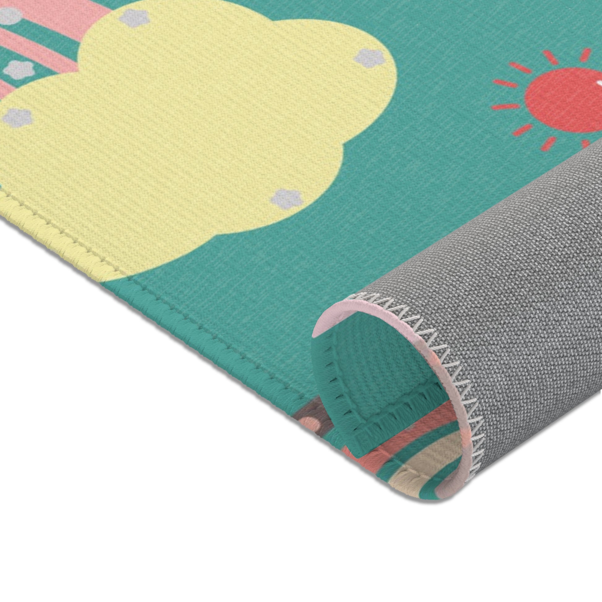 Corner detail of the Teal Sky Rainbows nursery area rug