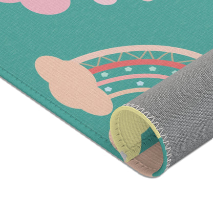 Rainbows, clouds and stars printed across the nursery area rug