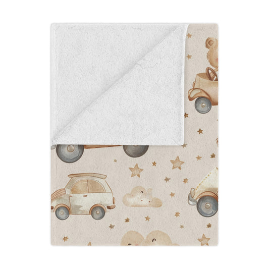 Teddy Roadtrip minky baby blanket draped over a crib