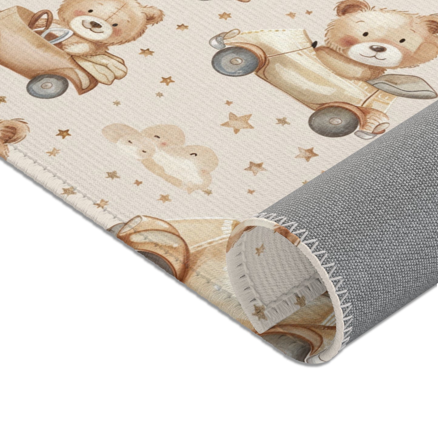 Bears, cars and small stars printed across the nursery area rug