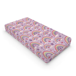 Violet Sky Rainbows changing pad cover on a nursery changing table