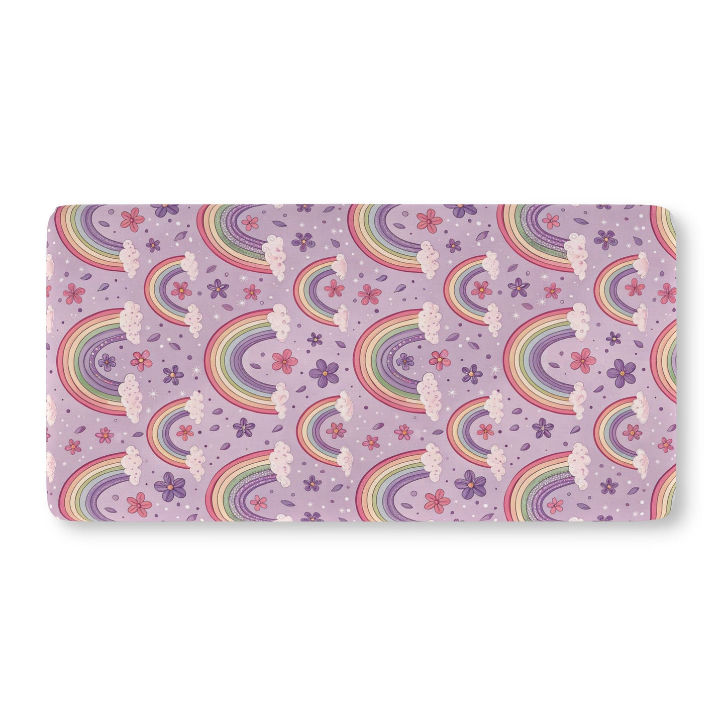 Fitted crib sheet with pastel rainbows and flowers on lilac