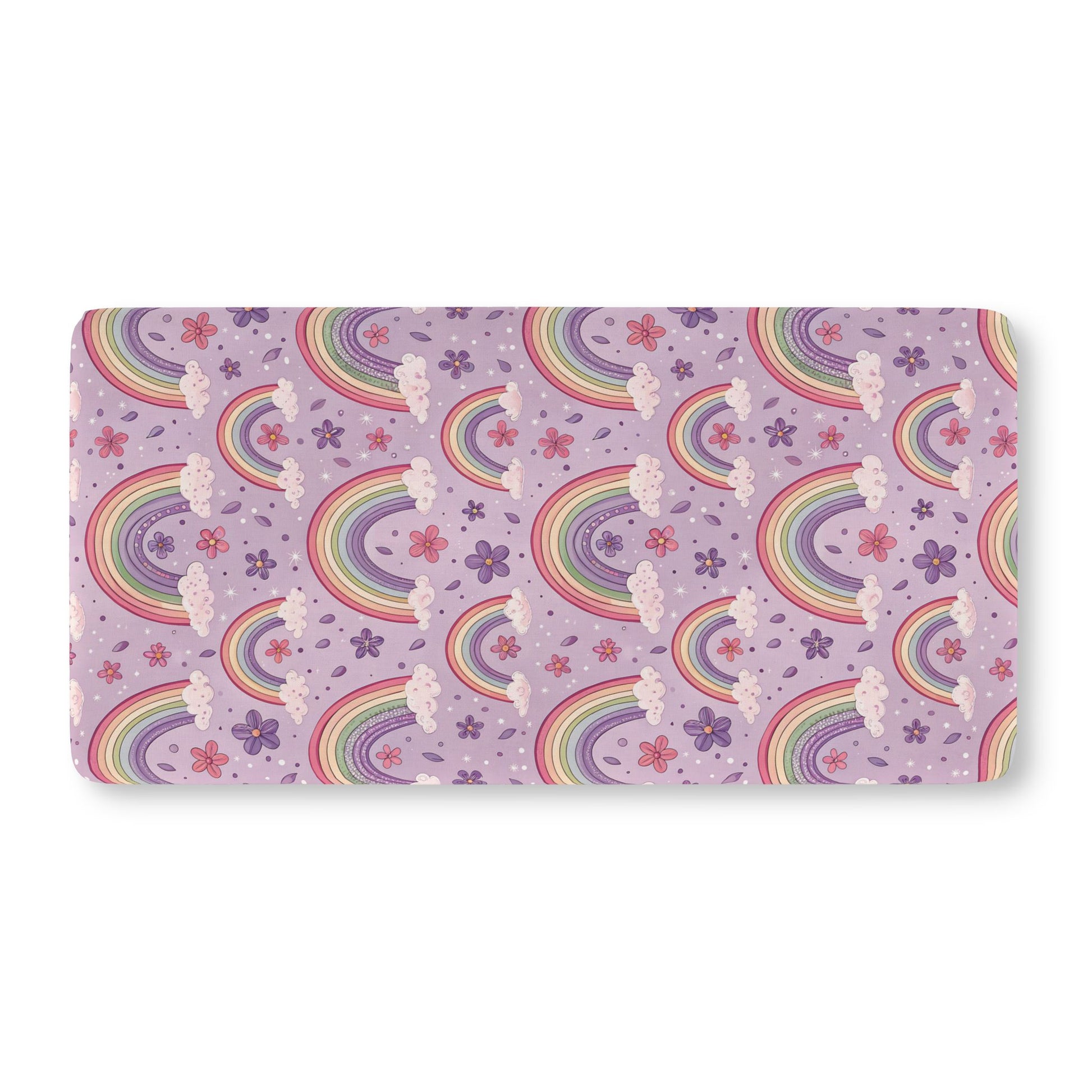 Fitted crib sheet with pastel rainbows and flowers on lilac